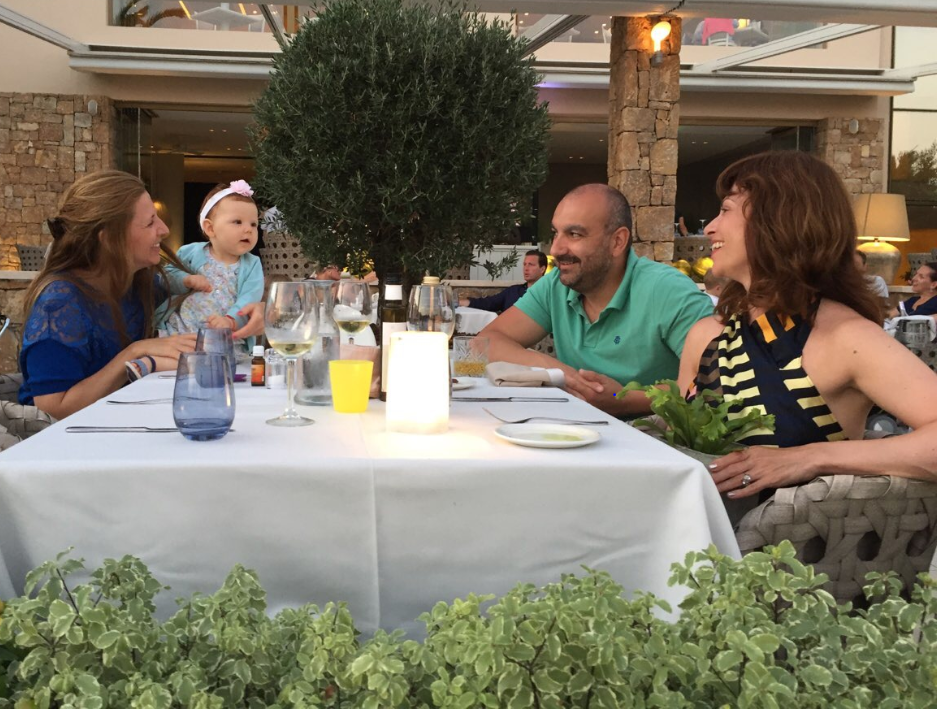 A group of people sitting at a table
Description automatically generated