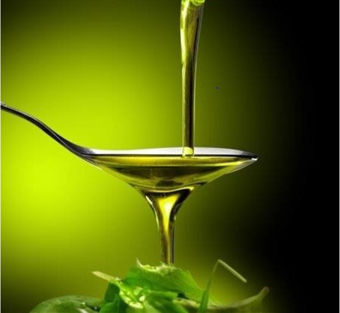 A spoon with a liquid pouring into it
Description automatically generated